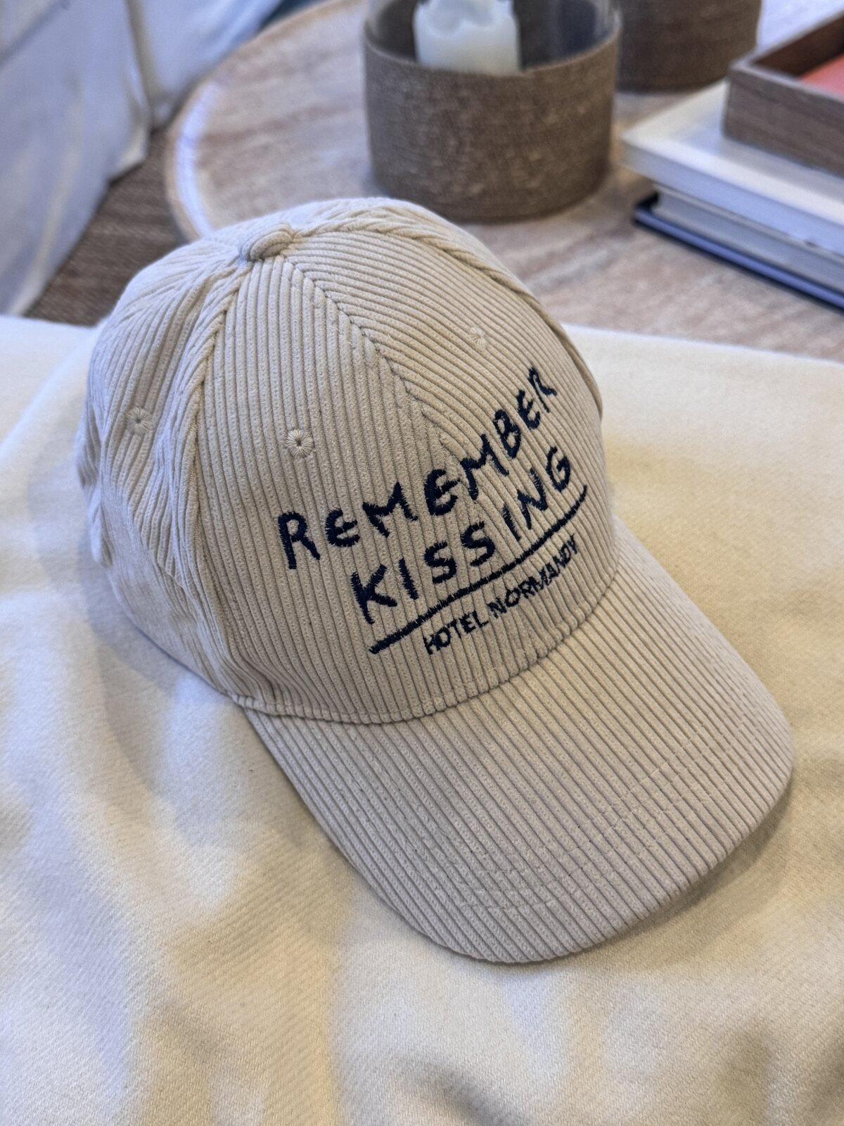 Corduroy cap with Remember Kissing embroidered on the front