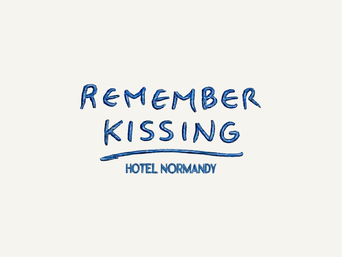 Cream cotton tote bag with Remember Kissing printed on it
